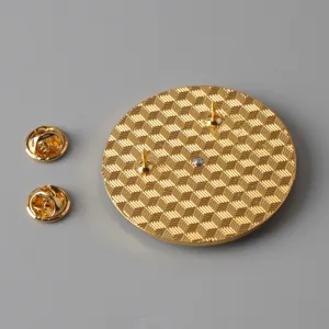 Detailed back view of the round metal badge pin showing dual posts and butterfly clutches.