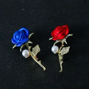 Close-up of elegant rhinestone red rose brooch detail, sparkling crystal and metal craft.