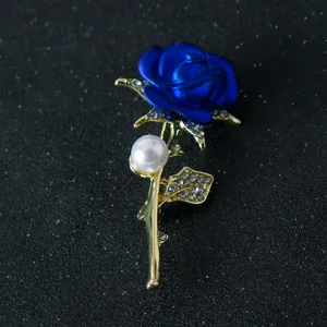 Blue rose flower brooch featuring a pearl and sparkling rhinestones, elegant fashion jewelry.