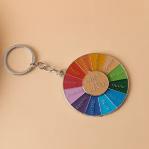 Novelty rainbow movie genre spinning wheel metal keychain perfect for film lovers.