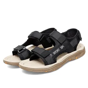 Detailed view of lightweight men outdoor sports sandals with velcro straps and comfortable beige sole.