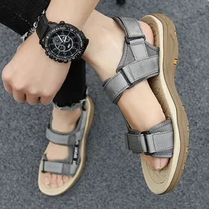 Men's summer outdoor sport sandals, lightweight grey hiking footwear close-up detail.