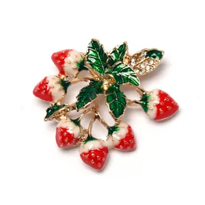Enamel strawberry brooch detail, cute fruit pin with sparkling crystal leaves and gold tone metal.