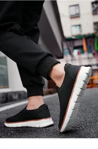 Detail shot of men's breathable mesh slip-on casual sneakers showing the sole flexibility.