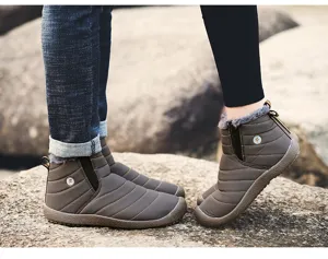 Detail shot of winter fleece-lined snow boots showcasing quilted texture, warm lining, and grip sole.