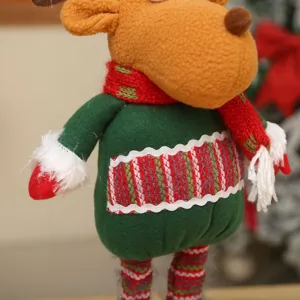 Christmas plush reindeer doll desktop decoration with green sweater and red scarf.