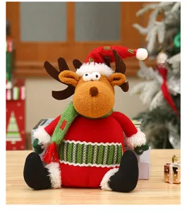 Christmas sitting reindeer plush doll with knit hat and scarf, perfect holiday decor.