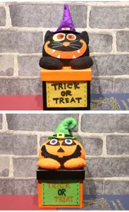 Halloween Pop-Up Süßigkeiten-Geschenkbox mit schwarzer Katze und Kürbis Plüschtier Dekoration.