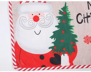 Christmas table mat detail close-up with Santa Claus print and festive holiday fabric design.