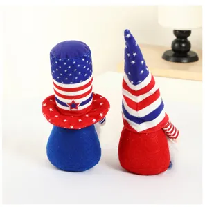 Close-up detail of US Independence Day gnome plush dolls with patriotic stripe designs.