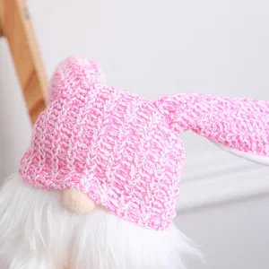 Easter bunny ear faceless doll gnome plush toy with pink knitted hat for holiday party decor.