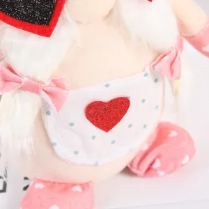Valentine plush gnome doll with heart apron, cute faceless Rudolf ornament for holiday decor.
