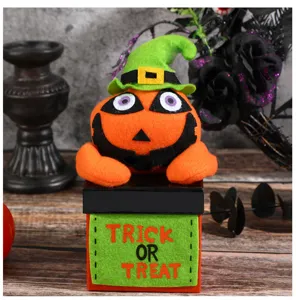 Halloween cute plush pumpkin toy in gift box with trick or treat text festival party decor detail shot