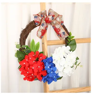 American Independence Day wreath with red white blue hydrangeas and patriotic burlap bow.