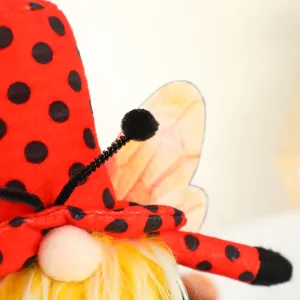 Cute ladybug gnome plush toy with red polka dot hat, yellow beard and wings for festival decor.