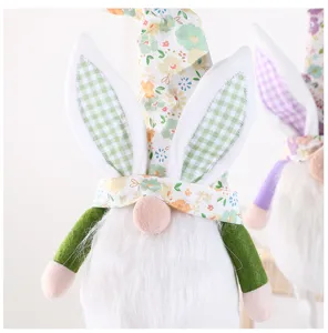 Easter gnome plush detail view featuring cute bunny ears, floral hat and fluffy white beard.