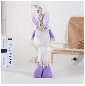 Detail shot of Easter gnome plush doll with bunny ears and purple floral hat, cozy home decor.