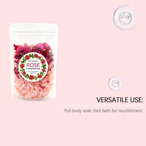 Detail view of OCEAURA rose scented bath salt pouch, showing crystal salt and dried petals.