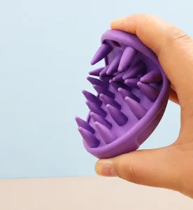 Silicone pet massage brush detail showing flexibility and soft bendable material design.