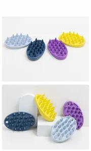 Silicone pet bath brush for cats and dogs, multi-color massage comb for grooming and bathing.