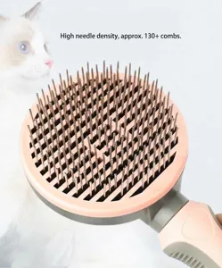 Pet grooming brush detail showing dense metal pins and pink round head for easy pet hair care.