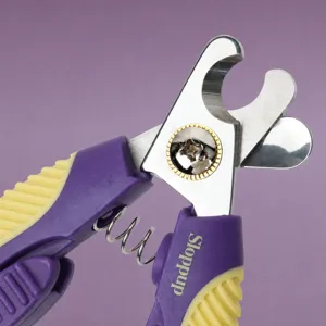 Professional stainless steel pet nail clipper with safety guard and ergonomic handle.