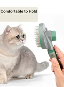 Detail view of the pet grooming slicker brush featuring a comfortable non-slip rubberized handle.