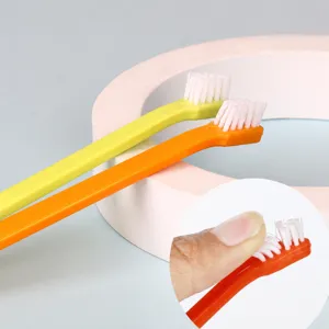 Pet toothbrush with soft nylon bristles for small dog and cat oral cleaning tool.