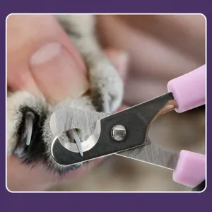 Professional pet nail clipper with stainless steel blade and pink handle for cats and dogs.