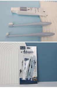 Pet dental care set with toothpaste and two toothbrushes for dog and cat oral hygiene.