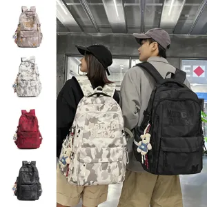 Hong Kong style fashion camo student backpack with cute bear pendant and multi-compartments.