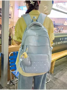Light blue star print school backpack with multi compartments and cute pendant detail.