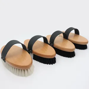 Wooden horse hair grooming brush with leather strap for equestrian care and cleaning tools