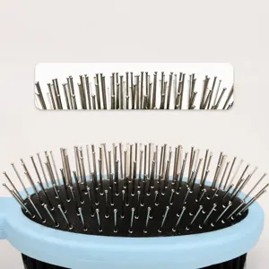 Pet grooming brush with round metal pins for gentle massage and de-shedding dogs and cats.