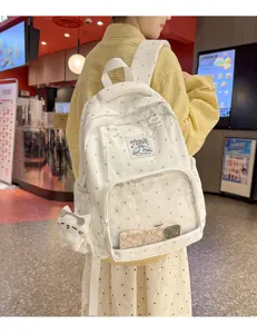 Zaino a pois bianco stile coreano con tasca frontale trasparente e design carino.