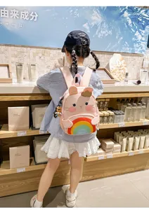 Cute pink cartoon rabbit kids backpack with colorful rainbow design for 3-6 year girls.