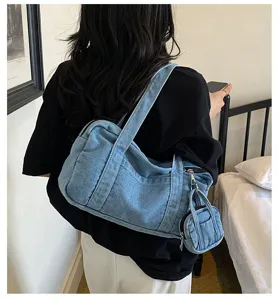 Detail view of casual vintage washed denim shoulder bag with mini pouch, versatile underarm.