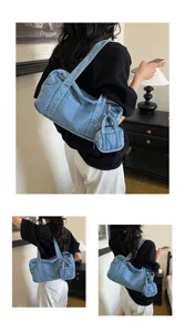 Detailed view of the vintage washed denim shoulder bag with casual everyday commuting style.