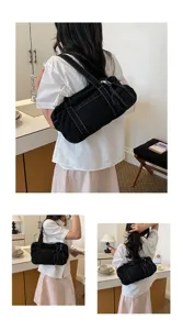 Vintage washed black canvas shoulder bag for women, casual commuter underarm tote bag daily.