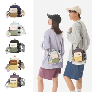 Sac bandoulière décontracté colorblock pour téléphone, sacoche élégante en plein air.