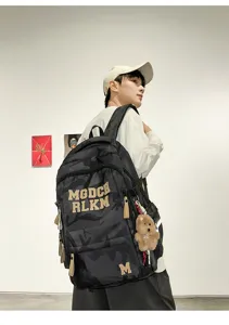 Detailed view of the stylish camouflage student backpack, showcasing large capacity and design.