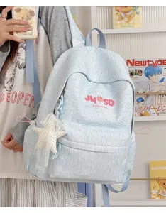 Mochila escolar azul claro elegante con letras bordadas y bonito colgante de estrella.