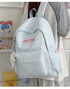 Mochila de estudiante jaspeada azul claro de gran capacidad con bolsillos delanteros y laterales.