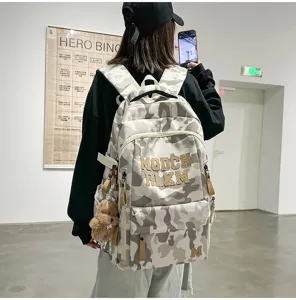 Fashionable camouflage large capacity student backpack for school and daily casual wear.