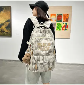 Trendy camouflage large capacity school backpack for women students, comfortable daily bag.