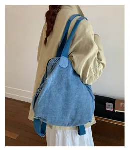 Sac à dos et fourre-tout en denim lavé vintage, grand format décontracté pour le travail.