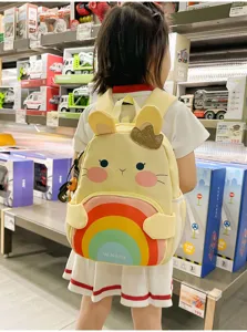 Cute cartoon children backpack with rainbow design, stylish and comfortable for 3-6 years old kids.