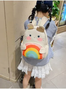 Cute cartoon kids backpack with cute rainbow design, soft canvas material, ideal for daily school use.