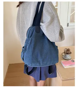 Sac a dos en denim lave vintage pour femme, grande capacite decontracte multifonctionnel.