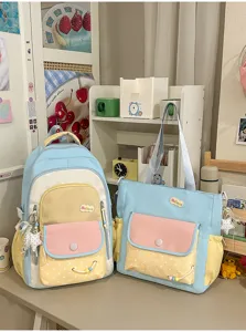 Niedliches, farbblockierendes zweiteiliges Schulrucksack- und Tragetaschenset für Schüler.
